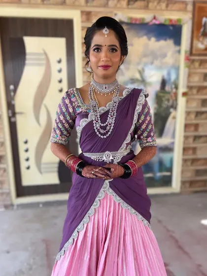 The full view of Nayan's unique reception outfit. The draping is modern and stylish, and the makeup completes the elegant look.