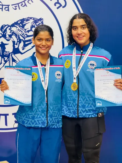 A double podium finish for our talented backstroke swimmers. Vihitha Nayana and Naisha celebrate their gold and silver medals in the women's 200m backstroke, both achieving personal best times in a thrilling race.