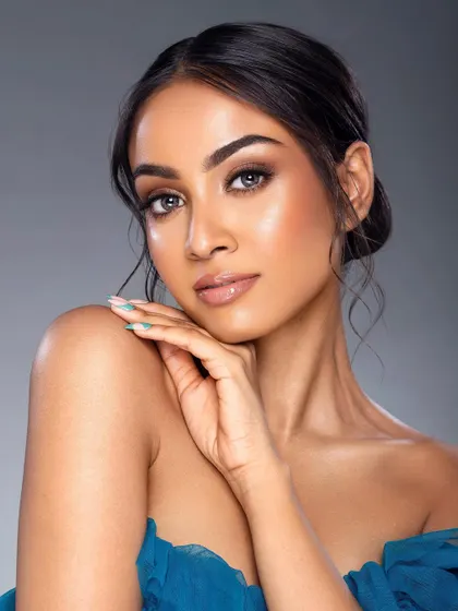 A soft and luminous portrait for a Nari lashes campaign. The model's pose is gentle, and the lighting creates a beautiful sheen on her skin, complementing the natural-looking lashes.