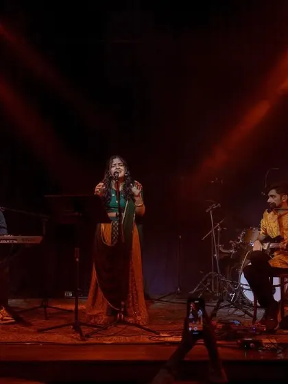 Center stage at The Piano Man, supported by my talented band on keys and mandolin. The warm lighting and engaged audience made for a magical night of Indian classical jazz fusion.