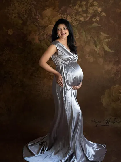 A classic full-length portrait against a painterly backdrop. This style of photography creates a timeless piece of art that you can hang on your walls for years to come.