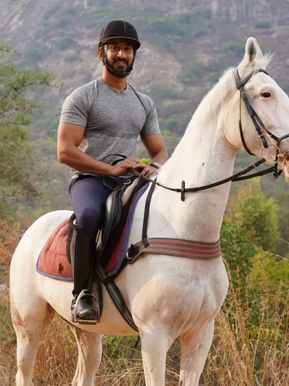 A moment of pride on the trail. A rider and his magnificent white horse posing against the backdrop of the hills we just conquered. This is the feeling of accomplishment we ride for.