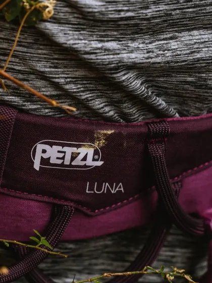 The Petzl Luna harness, another women's specific model we provide. Proper fit is essential for safety and comfort during long days of climbing.