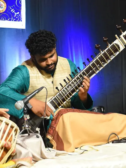 Here you can see the close coordination between me and the tabla player. This musical conversation is essential to a successful classical performance, creating a seamless rhythmic and melodic flow.