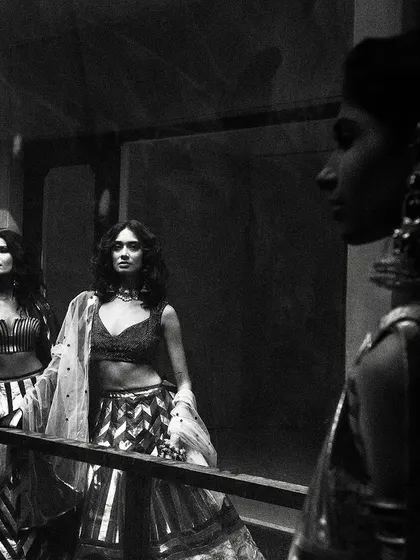 A moody, atmospheric black and white shot for designer Siddartha Tytler. The reflections and shadows create a complex, layered image that is both artistic and high-fashion.
