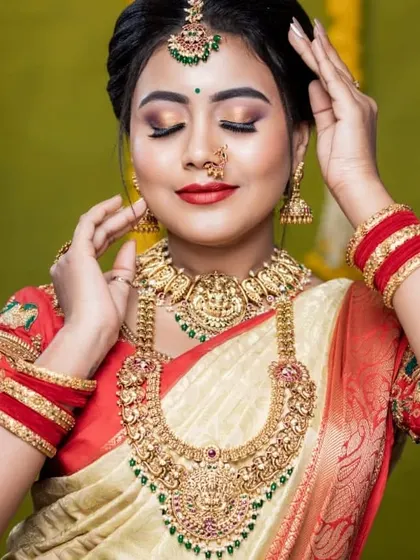 This bride is glowing. We styled her with a complete antique gold temple jewellery set, including a choker, a long Lakshmi haram, and a beautiful waist belt.