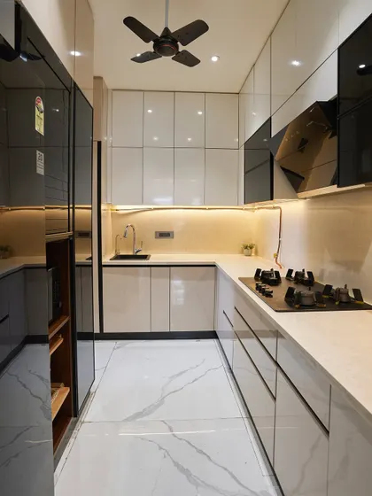 Another view of the compact and efficient kitchen, showing the integrated refrigerator and ample storage.