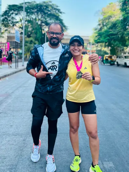 Post-race celebration with a friend and pacer who helped me achieve my personal best at the TCS10K. A strong support system is invaluable on race day.