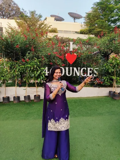 A candid shot from an engagement party at 46 Ounces. I make sure to connect with the crowd, using a mix of Hindi and English to make everyone feel included in the festivities.