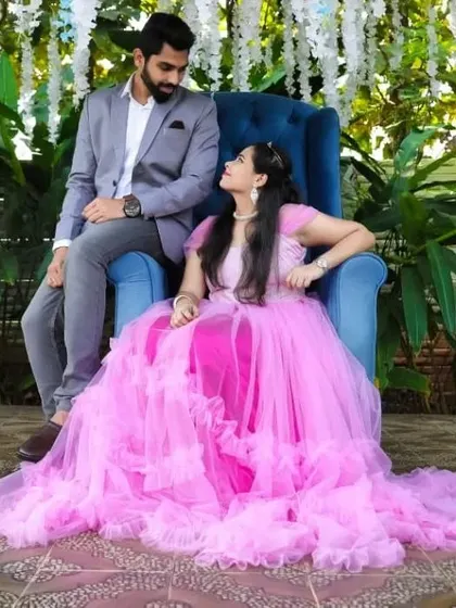A different view of the throne setup, showing the full spread of the pink ruffled gown.