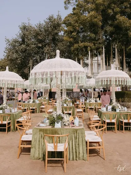 The overall seating arrangement for a lunch event, where each table was adorned with personalized, humorous cards, making the entire space feel unique.