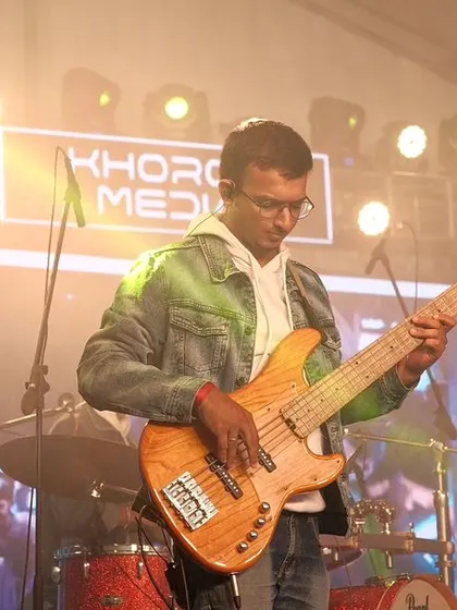 Our bassist holding down the groove at the RVITM show. A tight rhythm section is the foundation of our high-energy performances.