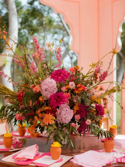 A lush and vibrant floral centerpiece from the 'Gulbahar' event. The mix of pinks, oranges, and yellows perfectly captured the bright, happy, and fun spirit of Holi.