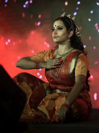 A serene moment captured during the performance. The makeup looks soft and radiant under the warm stage lights, highlighting the versatility of my character makeup skills.