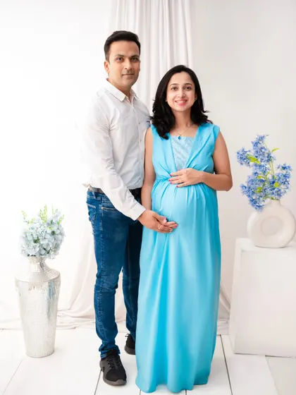 A classic standing portrait of the couple in our bright and airy minimalist set. The clean white background and simple styling create a timeless and elegant look.