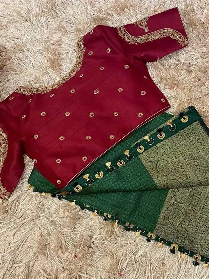 The front of the maroon blouse, showing the delicate butti embroidery all over.