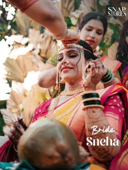 A beautiful moment during the bridal preparation, as a loved one helps with her hair. We capture the intimate 'getting ready' moments with sensitivity.