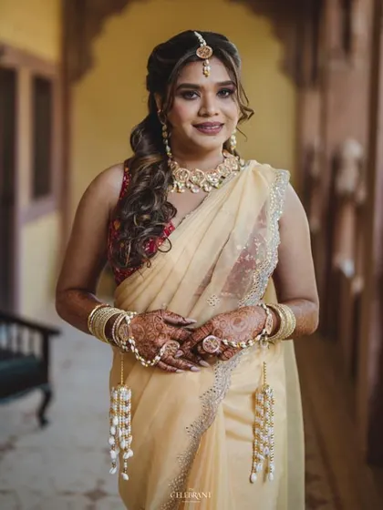 A portrait of the bride from her Jodhpur Haldi. She is wearing our custom haath phool with delicate hanging pearls and flowers.