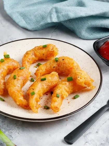 Our simply prepared Fried Prawns. These prawns are lightly battered and fried until golden, served with a side of ketchup for dipping.