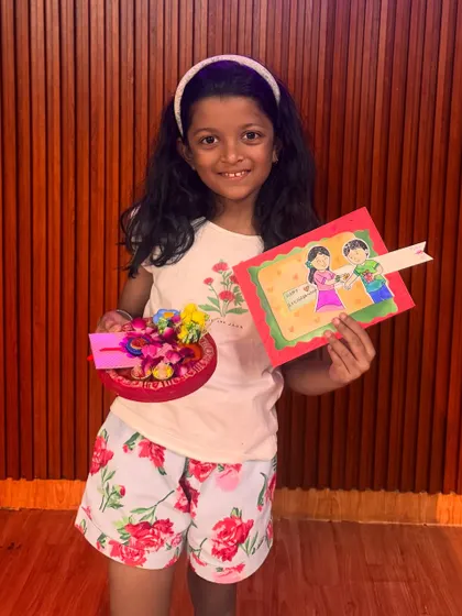 So proud of her creations. Our Rakhi workshop focuses on paper crafts, decoration, and assembling a complete festive platter that kids can use for the actual ceremony.