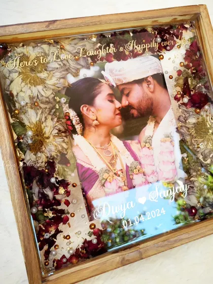 Another perspective of the custom wooden frame, highlighting the glossy finish and the intricate floral details.