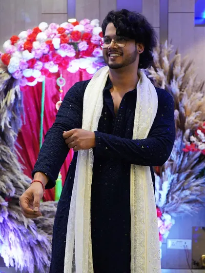 Getting ready before my performance at an engagement. The floral and pampas grass decor in the background shows the kind of beautiful events I get to be a part of.