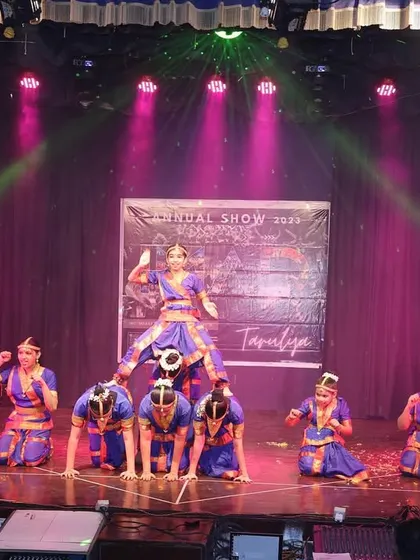A pyramid formation during the Bharatanatyam performance, showcasing both classical technique and athletic ability.