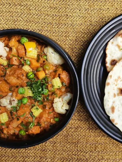 A perfect pairing for any meal. My Subz Dum Matka, a flavourful mixed vegetable curry, is served here with soft, freshly made Kulcha, straight from the tawa.