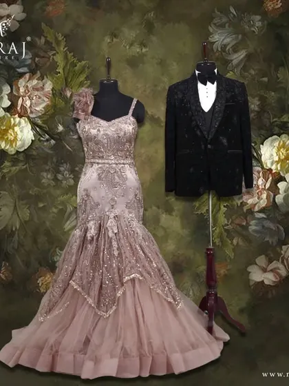 This couple shines together in ultimate style. The rich sequins and copper embellishments on her mermaid gown are complemented by the subtle sparkle of his black velvet tuxedo.