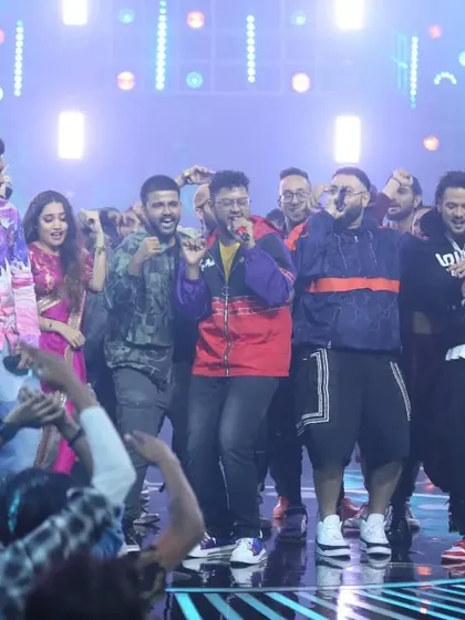 The whole squad on stage. This picture captures the chaos and camaraderie of the Hustle finale.