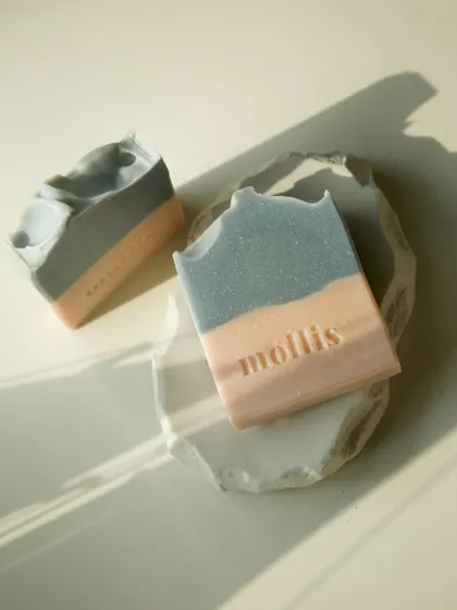 The 'Sweet Sage' bar on a handmade dish, a perfect pair for a sustainable bathroom.