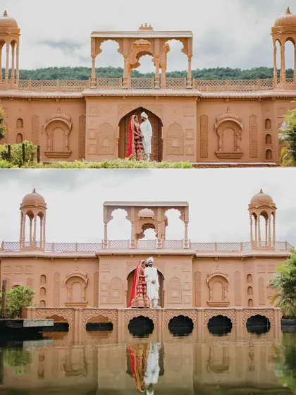 A stunning reflection shot of the couple standing on a bridge over the water. The symmetry and the grand architecture create a breathtaking and artistic wedding portrait.