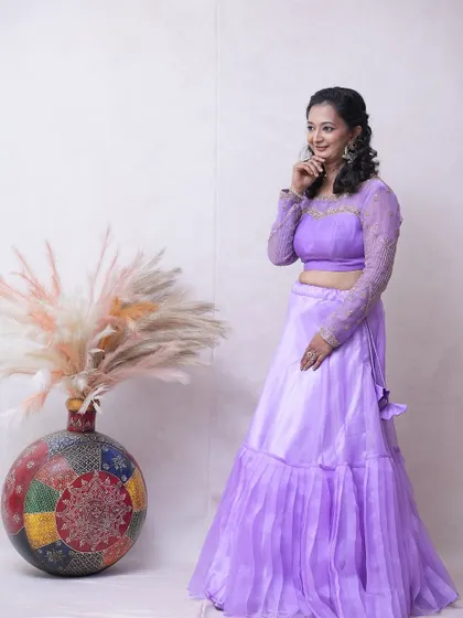 A candid shot showing the comfortable fit and pretty details of the lavender lehenga.