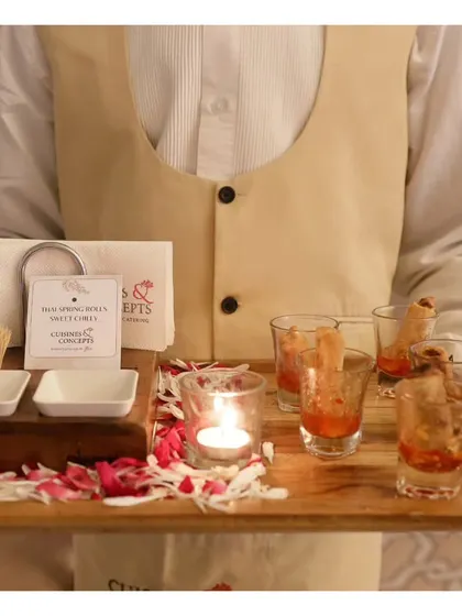 Thai Spring Rolls served in individual shot glasses with a sweet chili dip, an elegant and mess-free way to enjoy a classic appetizer.
