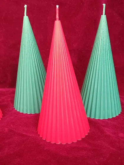 A close-up of the red and green ribbed pillar candles for Christmas.