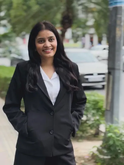 Walking on a city sidewalk, I am part of the community I serve. My work in student elections and judiciary matters keeps me grounded.