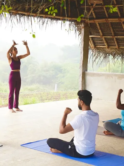 Leading a group in a seated practice during a wellness retreat. These moments of shared stillness and intention are incredibly powerful for building community and connection.