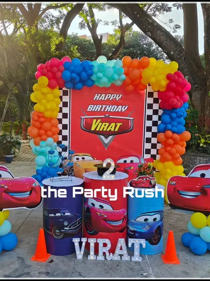 Virat's second birthday was a race to the finish line with this Disney Cars theme. The setup includes Lightning McQueen cutouts, a race track backdrop, and themed plinths, bringing the world of Radiator Springs to the party.
