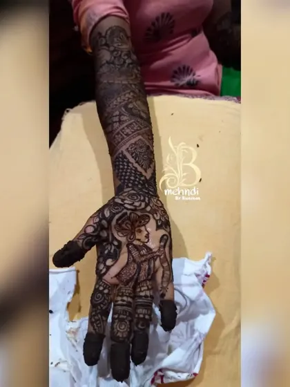 A close-up of the groom's portrait on the bride's hand. The dark stain makes every detail of the custom figure and surrounding patterns stand out beautifully.