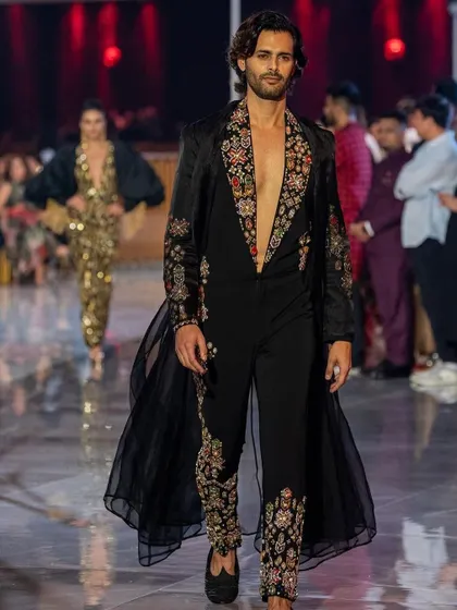 Another look from the Jio World Plaza launch, showcasing natural-looking grooming on the runway. The hair is styled with a soft, touchable texture to match the flowing garment.