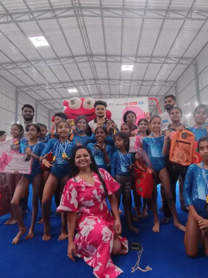 A fun group photo with the mascot at the IGCI competition. We believe in making competitive events enjoyable and memorable.