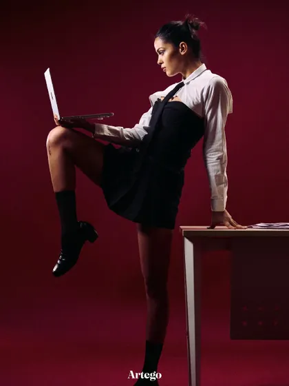 A dynamic pose from the "Back to School" shoot. The model is interacting with the props, which helps make the scene feel more alive and believable.