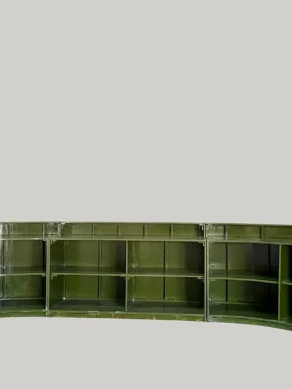 The back of our oval bar counter reveals extensive shelving, providing plenty of storage for bartenders to keep glassware, drinks, and supplies organized.