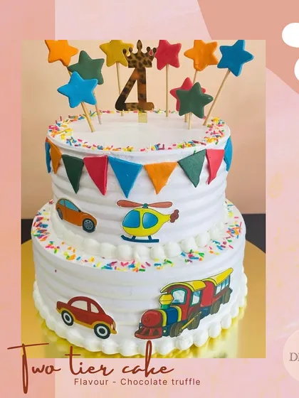 All aboard for a fun celebration! This two-tier transport theme cake is decorated with cars, a helicopter, and a train, perfect for a child who loves things that go.