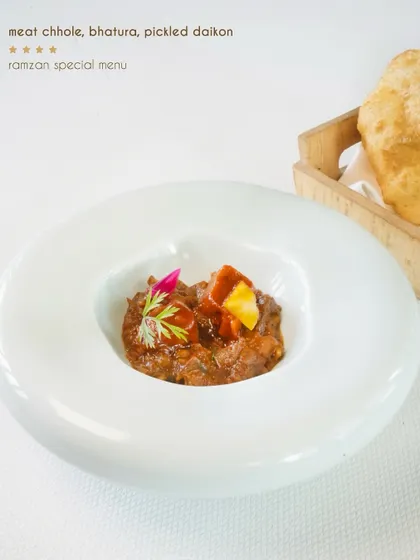 Meat chhole with bhatura and pickled daikon, a comforting and flavourful dish from our special Ramzan menu.