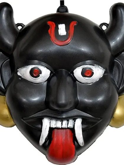 A close-up of the 'Nazar-Bottu', a traditional Indian charm to ward off the evil eye, updated as a functional robot. The eyes glow and the tongue is a scanner.
