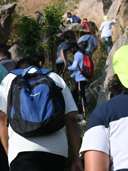 A view from behind as our team makes their way up the hill. We always move forward together.