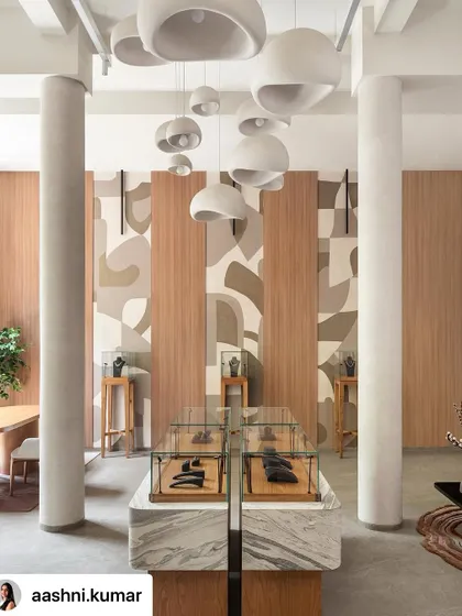Inspired by the facets of a diamond, this abstract mural was created for a jewelry boutique. The design uses layered, earthy tones and clean forms to create a sense of rhythm and elegance, complementing the store's sophisticated interior.