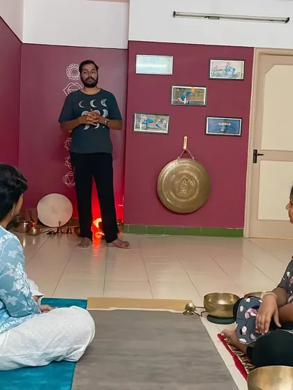 Here, I am explaining the principles of Nada Yoga to a small group of students. My courses are designed to be interactive, allowing for deep discussion and a personal understanding of the philosophy behind sound and its impact on our energy systems.