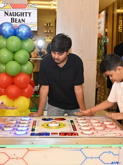 Kids competing at the 'Naughty Bean' whack-a-mole style game.